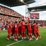 L'équipe nationale du Canada célébrant lors d'un match à domicile pour la Coupe du Monde 2026